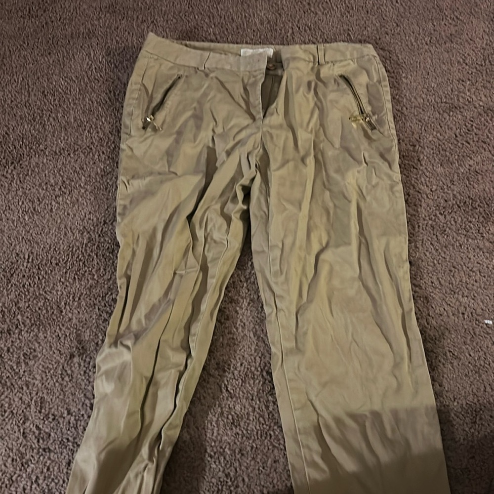 Michael Kors ; not actual pockets in the back; zipper pockets in the front
